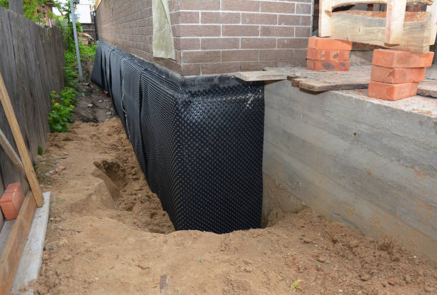 Happy homeowners after waterproofing job in Newfield